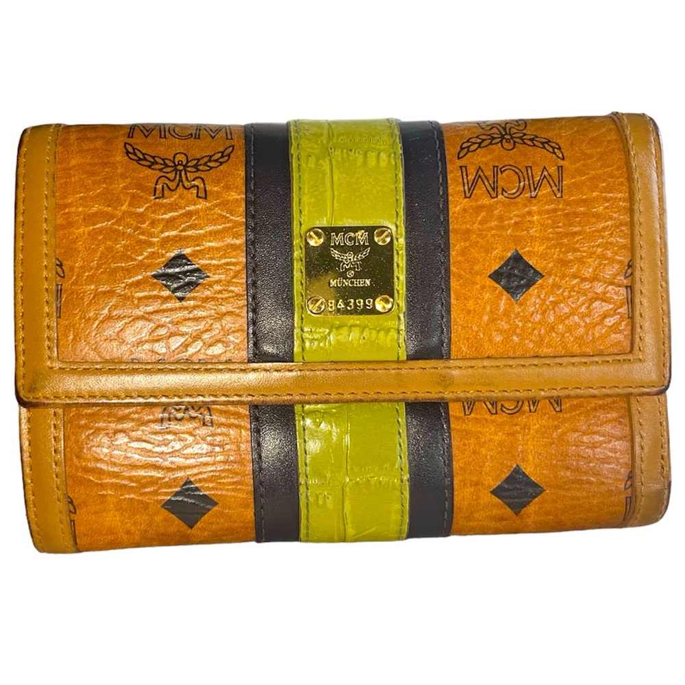 MCM Visetos tri-fold wallet in cognac leather with black and lime green stripe.